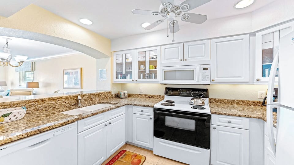 Fully equipped kitchen with a breakfast bar, making meal prep effortless and enjoyable.