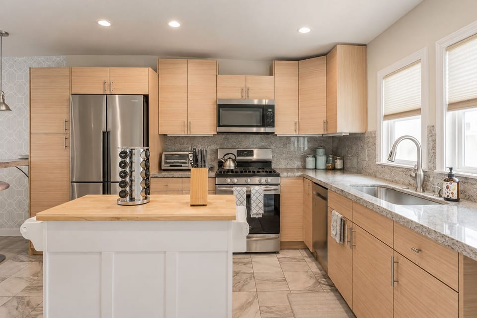 Fully Stocked Kitchen with stainless appliances plus coffee center, spice rack, knife block and toaster oven.