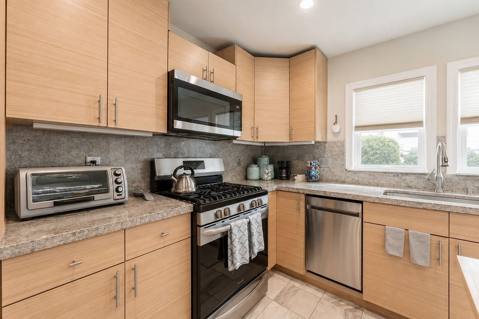Kitchen with Breakfast Bar Perfect for morning coffee or casual bites, the breakfast bar adds extra space to gather and connect.