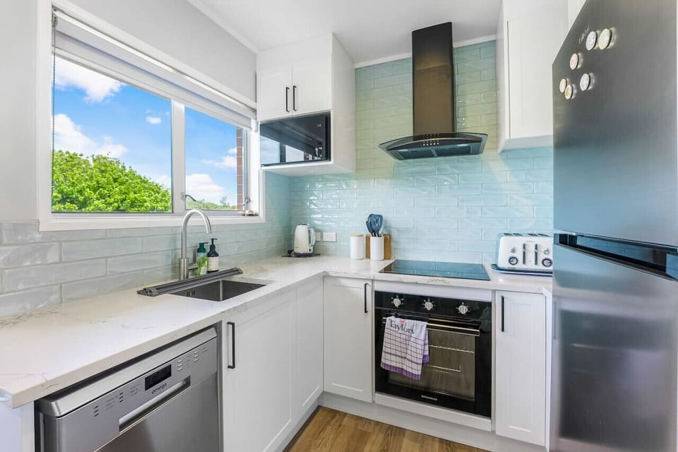 Enjoy cooking in this great modernised kitchen that has a new fridge, glass cook top and oven, dishwasher, microwave and extractor fan.