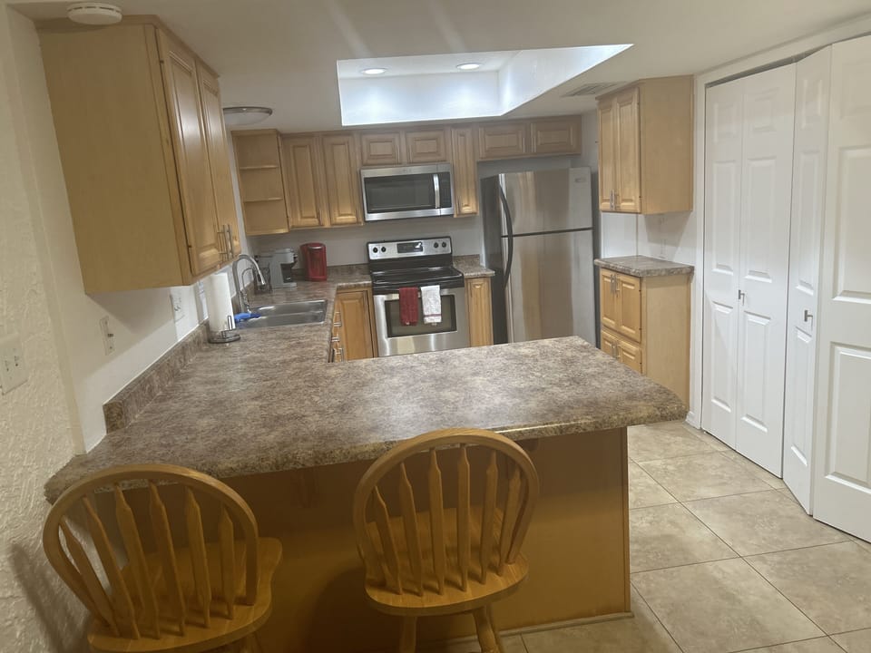 Kitchen with appliances , dishes, cookware , coffee maker , toaster and more 