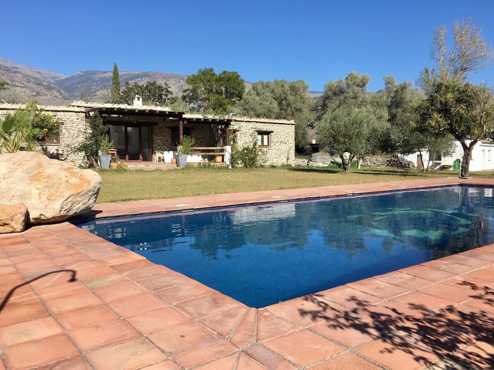 Cortijo front terrace and casita to the right
