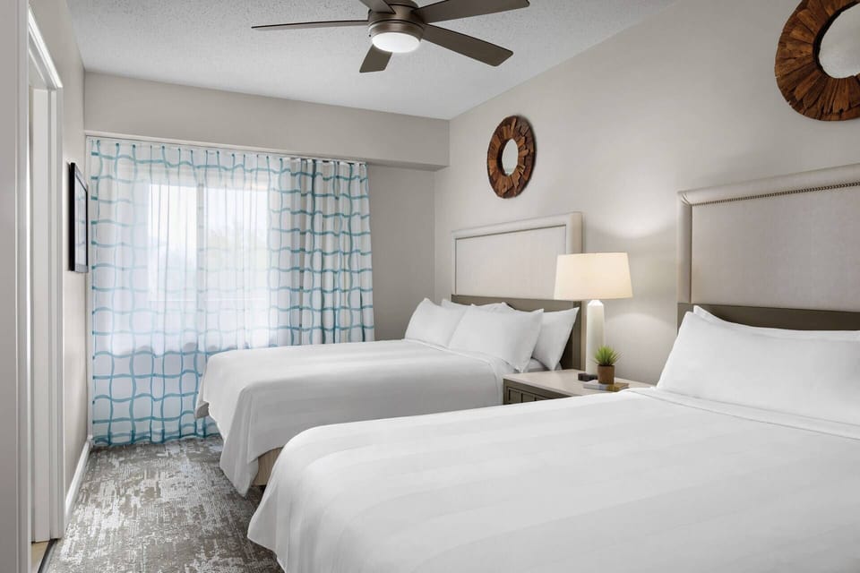 Guest bedroom features two queen beds.