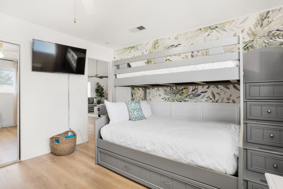 Bunk room with flat screen TV