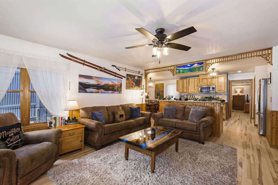 Living area equipped with a view and ceiling fan for comfort.