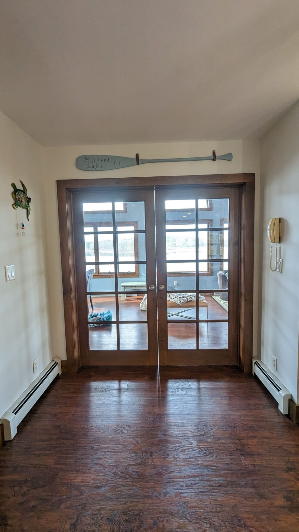 doors into the sunroom off the main floor. 1 step down