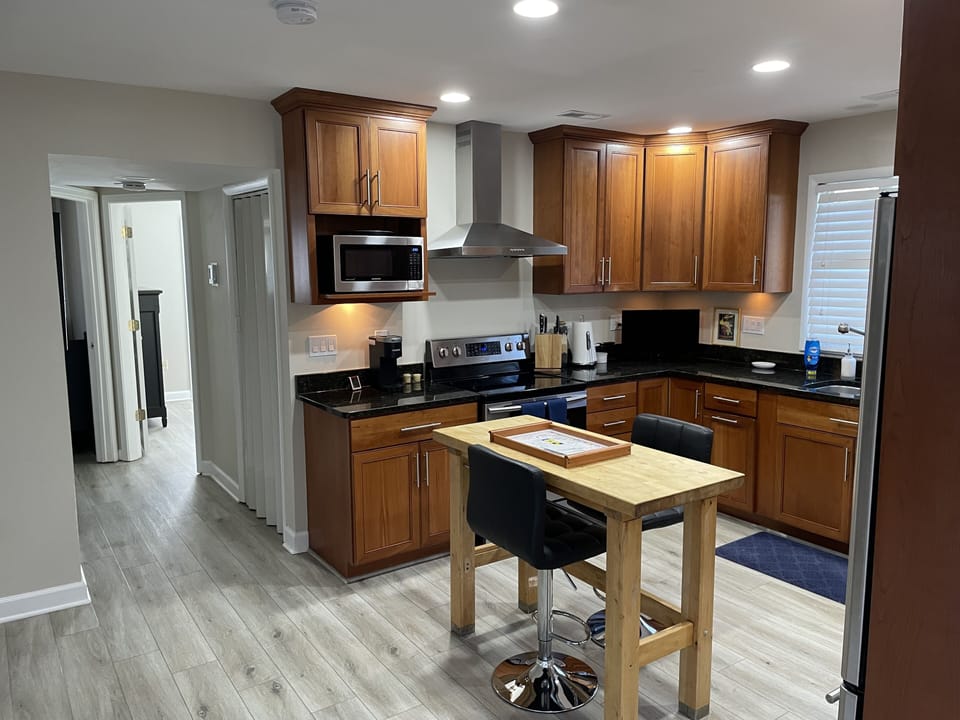 Kitchen includes stove, oven, microwave, fridge, Keurig, and toaster oven