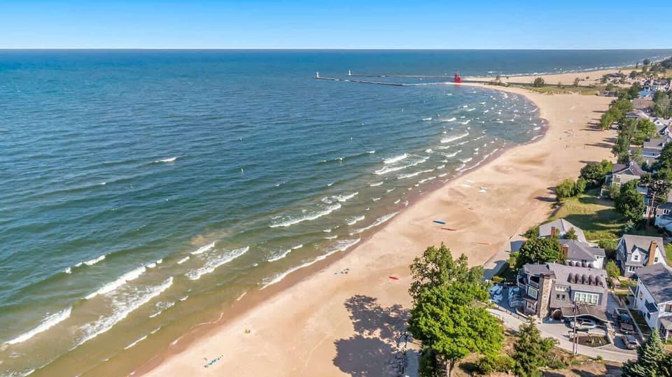 Drone image of Lake Michigan, the beach, Big Red and the pier