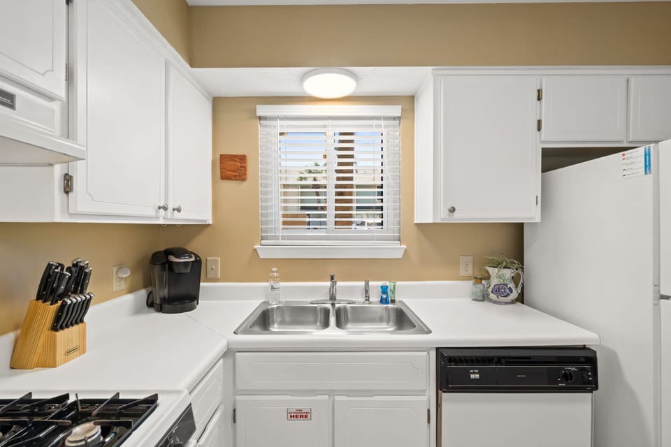 Fully Stocked Kitchen with Island Bar Seating