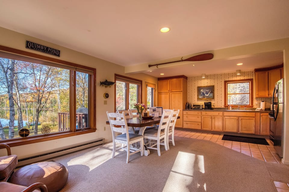 Beautiful views of Quimby Pond through large windows on the main floor
