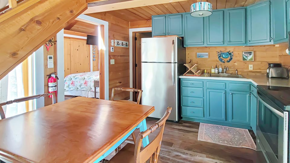 Dining area and nicely equipped kitchen