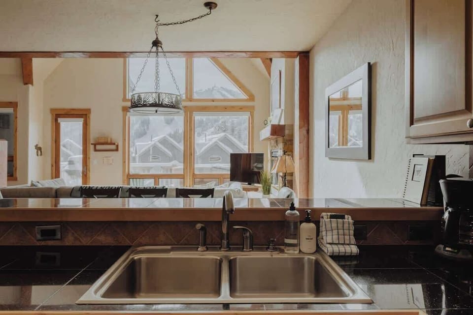 Open kitchen with a view of friends/family & outdoor fun