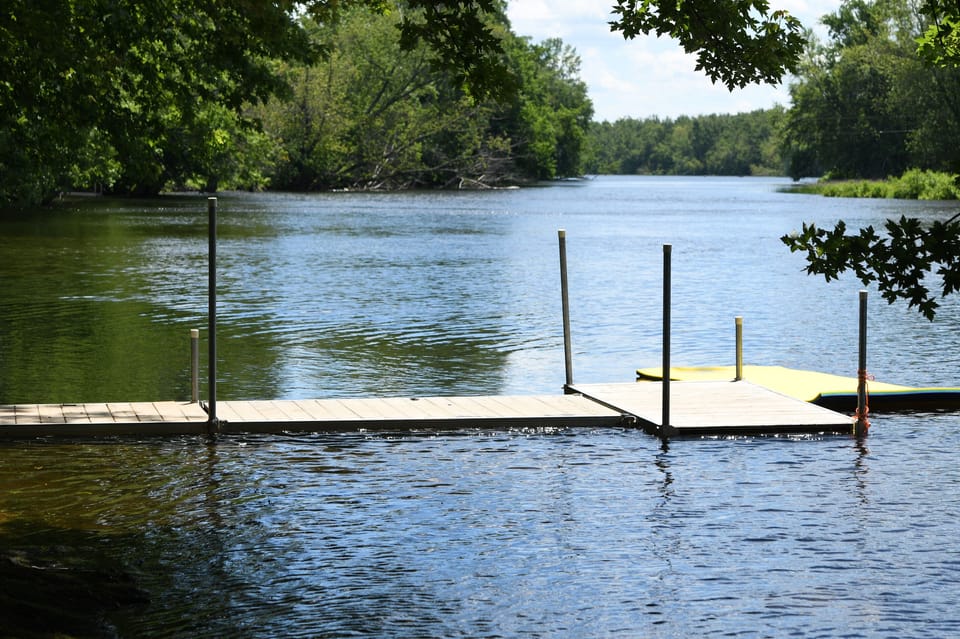 spacious clean swimmable riverfront with shallow entry for littles. Fish from the dock, we've caught plenty here.