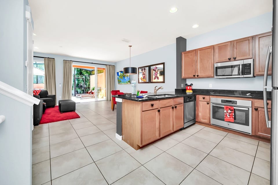 Large open kitchen with stainless appliances and solid surface countertops