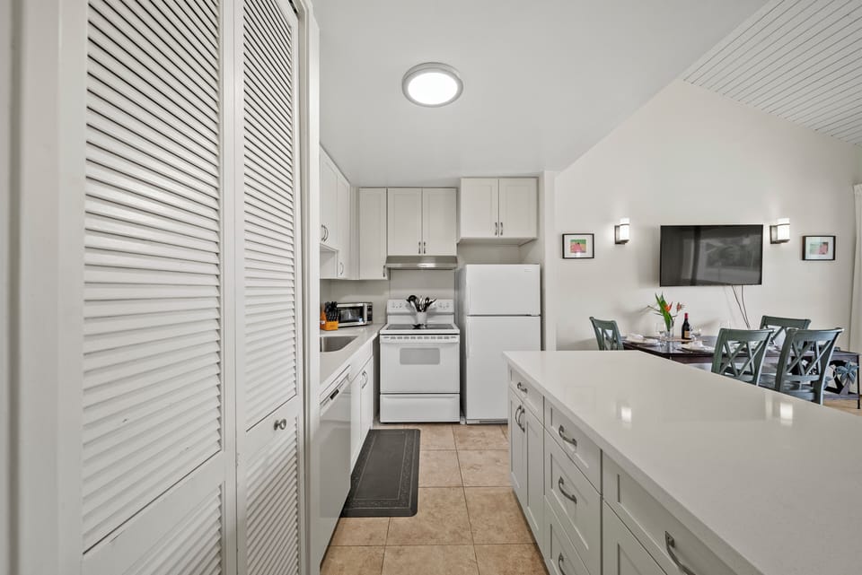 Whip up your favorite meals in a kitchen with generous counters—ideal for cooking together or prepping snacks before your next adventure.