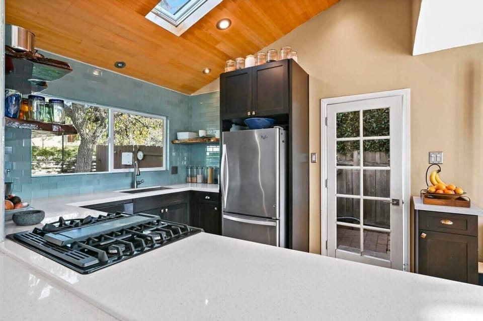 Inner view of the kitchen, along with the patio door leading to the hot tub