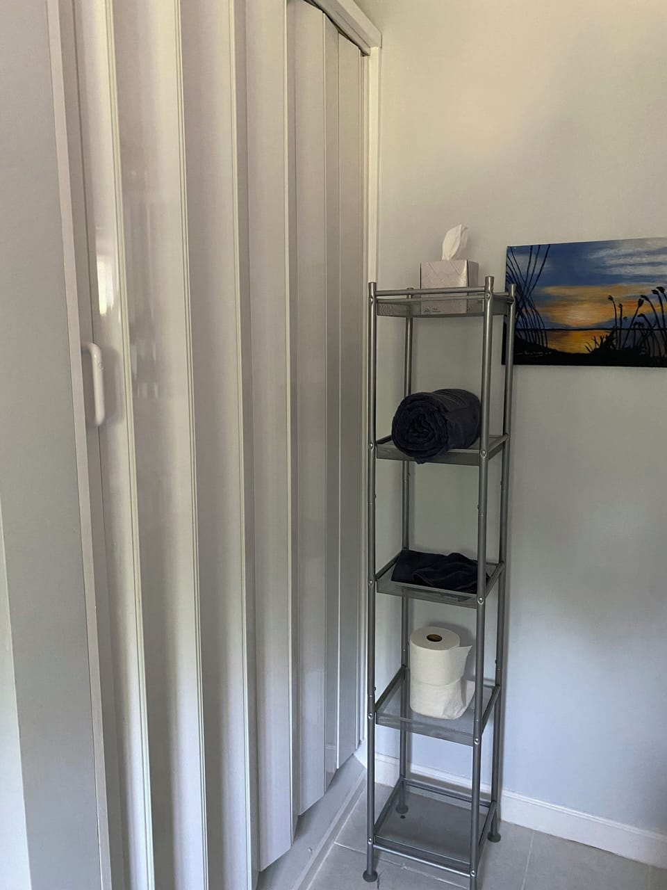 Extra storage closet in upper bathroom