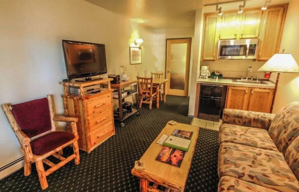 The living area has a convenient kitchenette for refreshments at home!