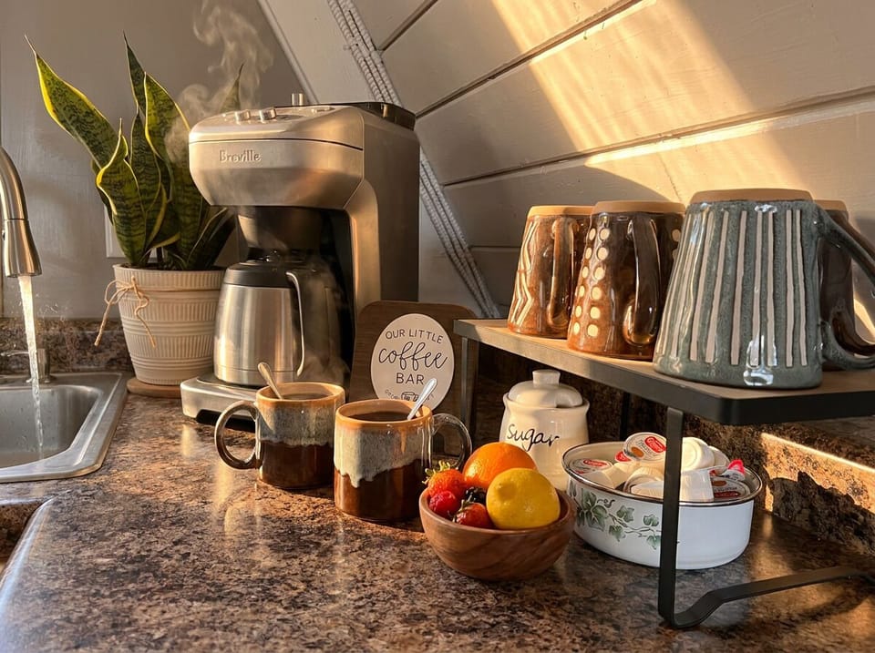 Coffee bar offering drip, grinder or easy to use Keurig. Starter K-Cups provided along with sugar and cream.