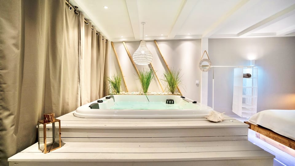 Bedroom with hot tub