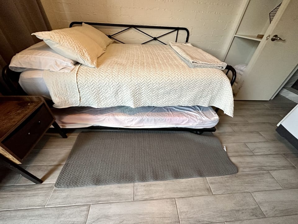 Full size bed with single pull out trundle 