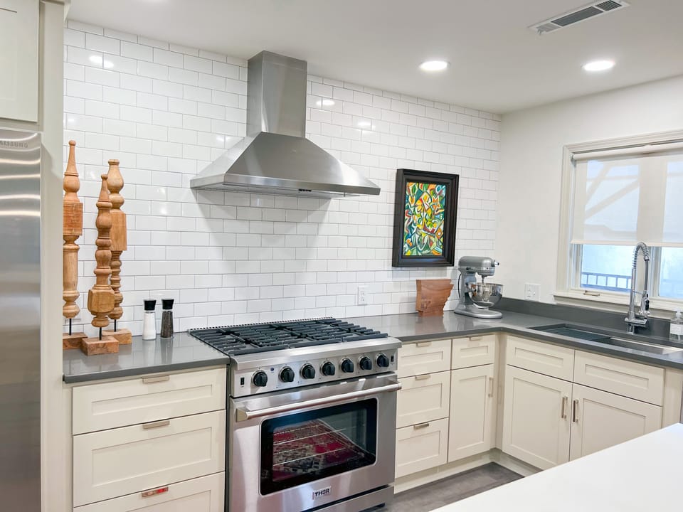 Fully stocked kitchen with premiere appliances, microwave, cutlery, + more.