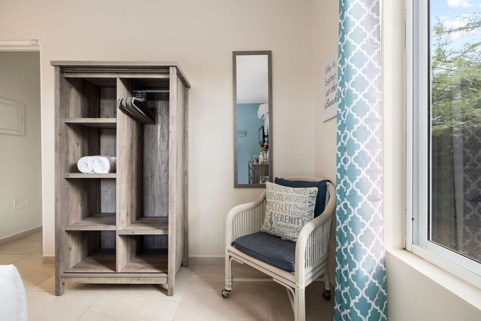 An open closet for your clothes and other belongings.