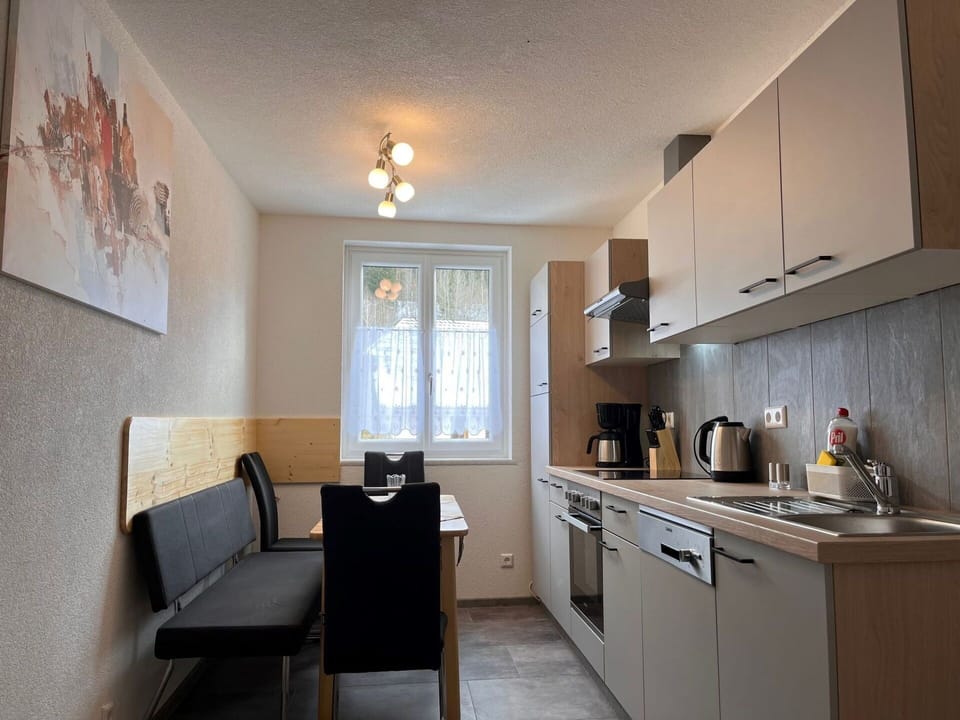 Property, Cabinetry, Countertop, Wood, Interior Design, Lighting, Chair, Flooring, Floor, Kitchen Stove