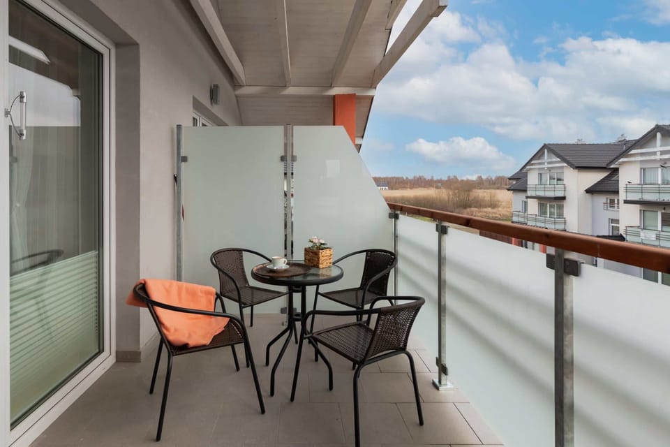 A balcony with outdoor seating, perfect for enjoying the views and fresh air.
