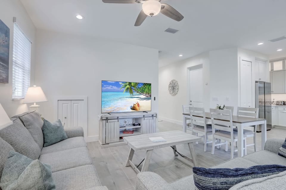 Looking Towards the Dining Room and Kitchen; The Door In the Hallway Leads to the Garage