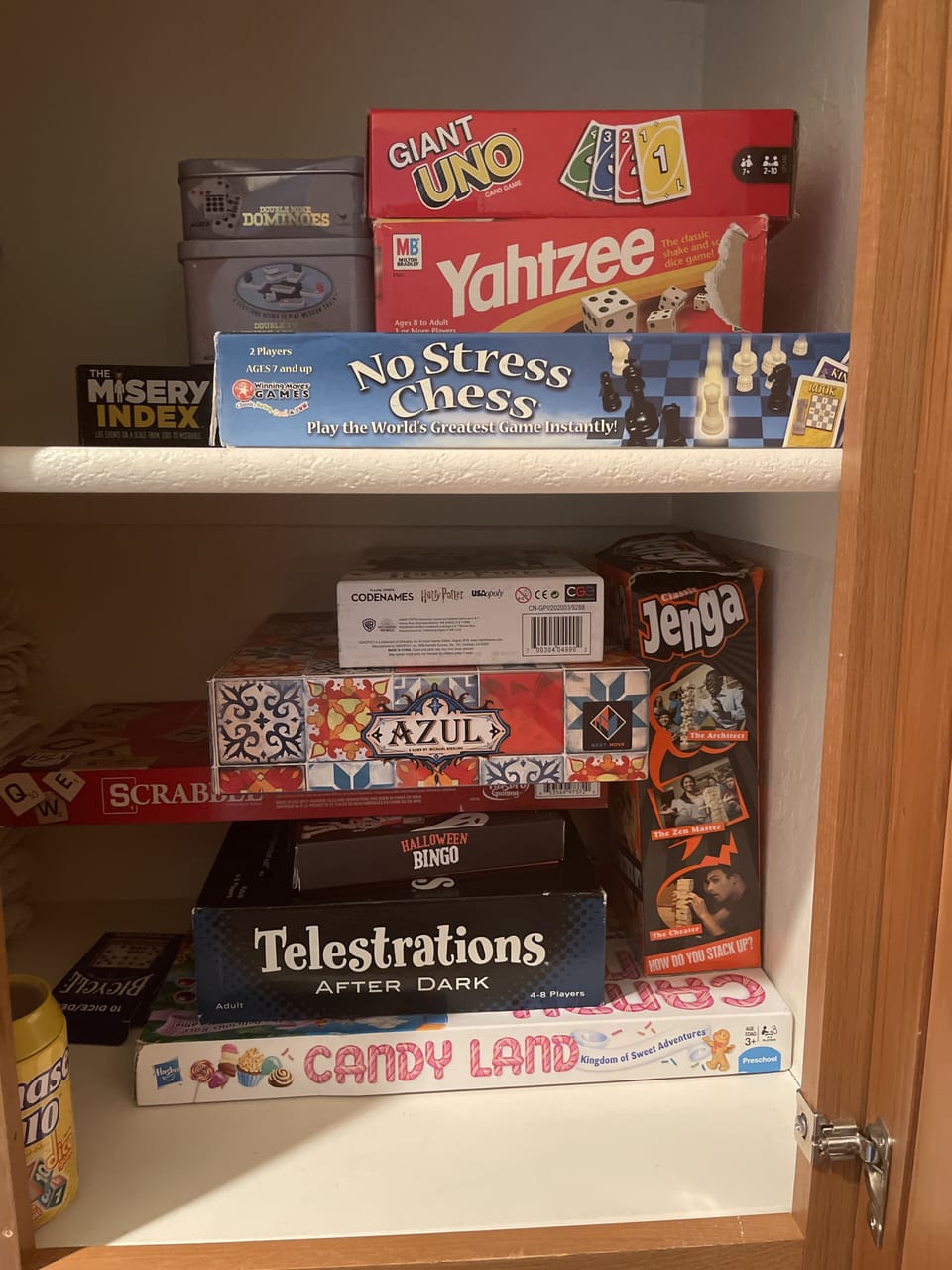 Board game selection in closet by guest bathroom