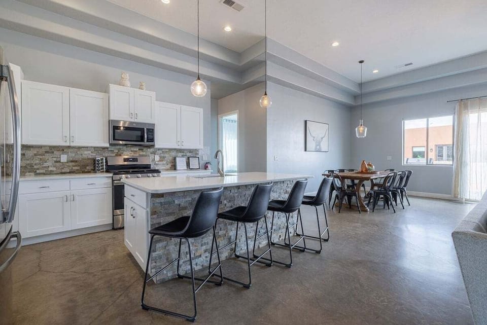 Kitchen Barstools seat 4, Dining Table seats 8.