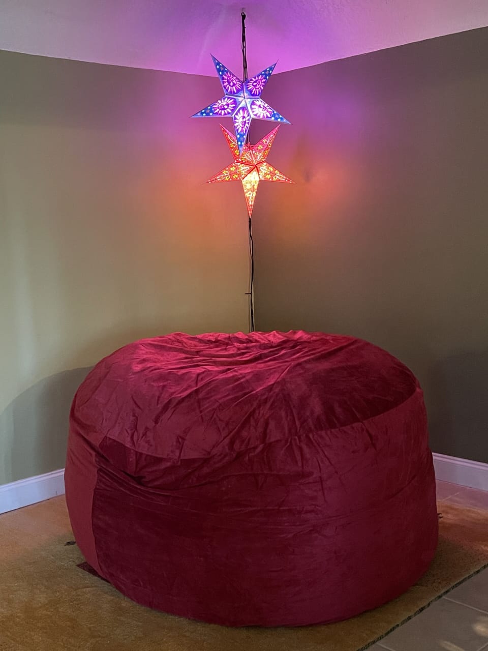 Giant beanbag chair in living area near hallway to bedroom