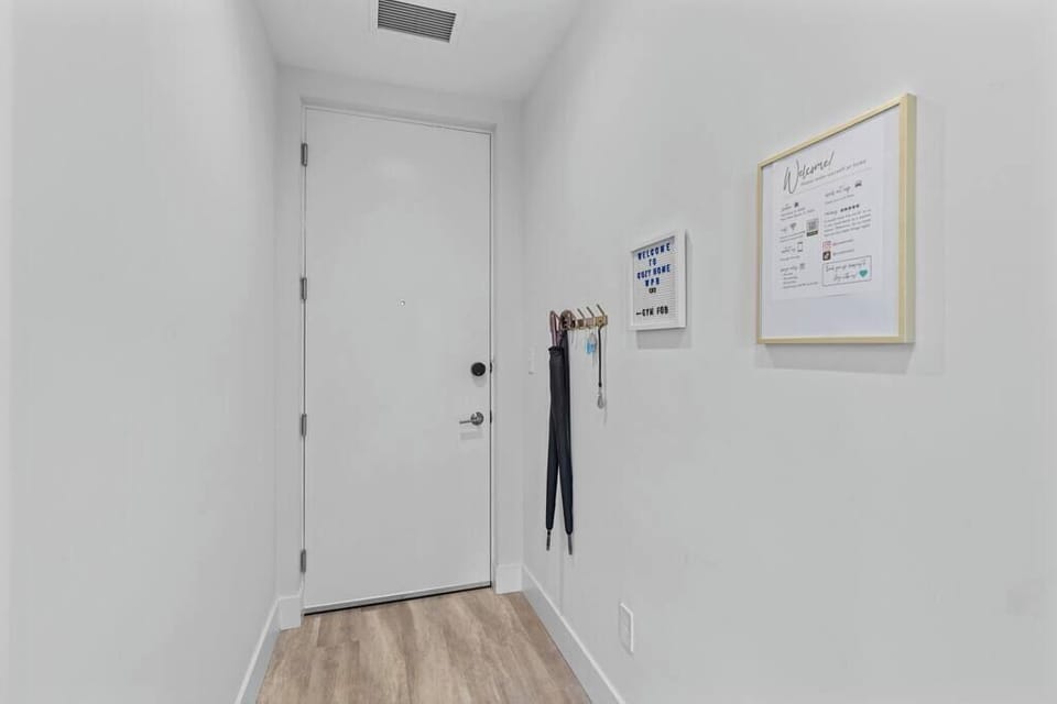 [Entryway] - two umbrellas, gym fob for access to fitness center