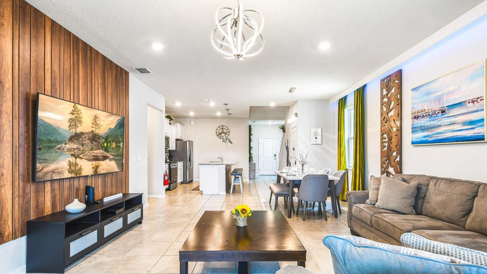 Roomy living area embelished with a comfortable sofa - perfect for creating a warm and inviting atmosphere during a family reunion.
