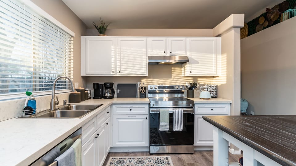 Spacious kitchen with brand new oven/range and fully stocked kitchen