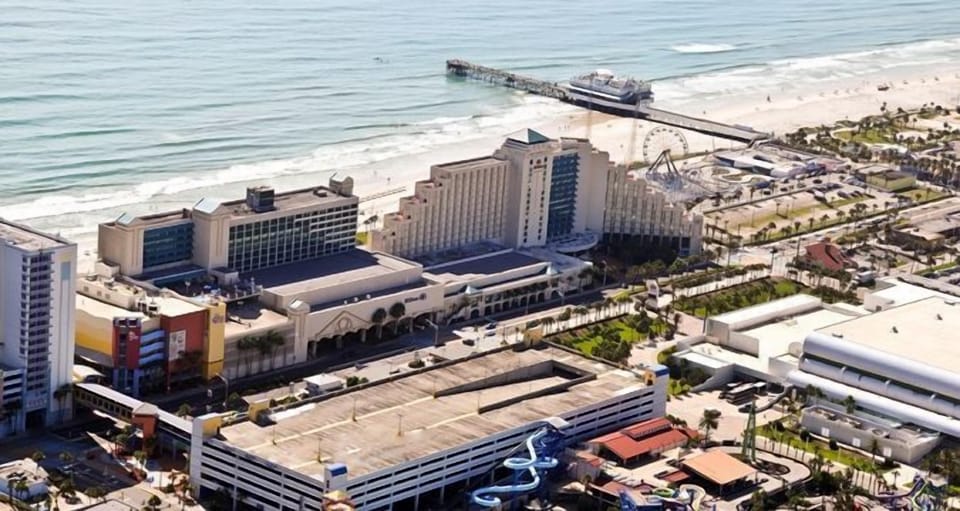 Arrive at a sprawling beachfront resort steps from the sand.