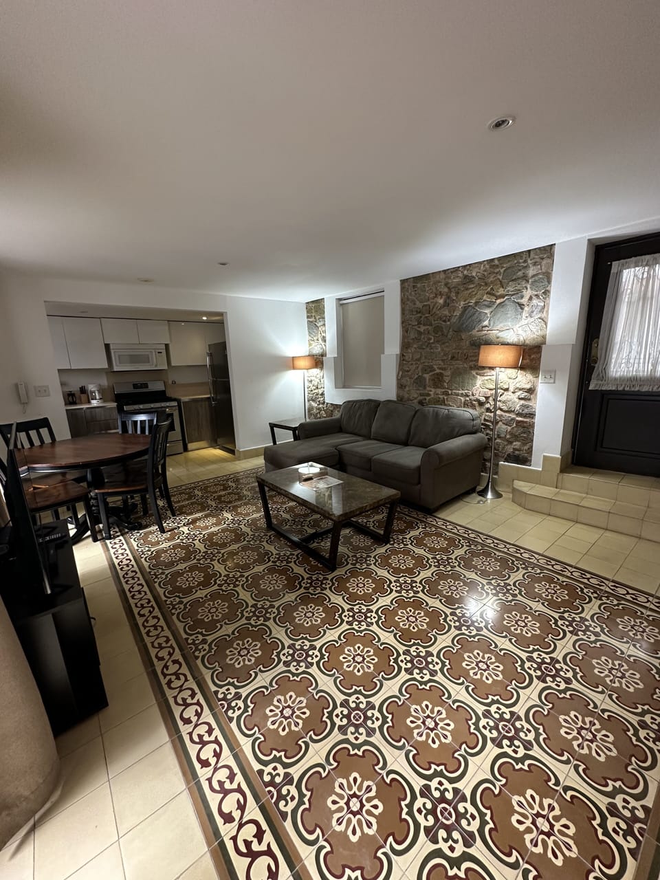
Living room with comfortabe sofa and a Smart TV with cable TV. 