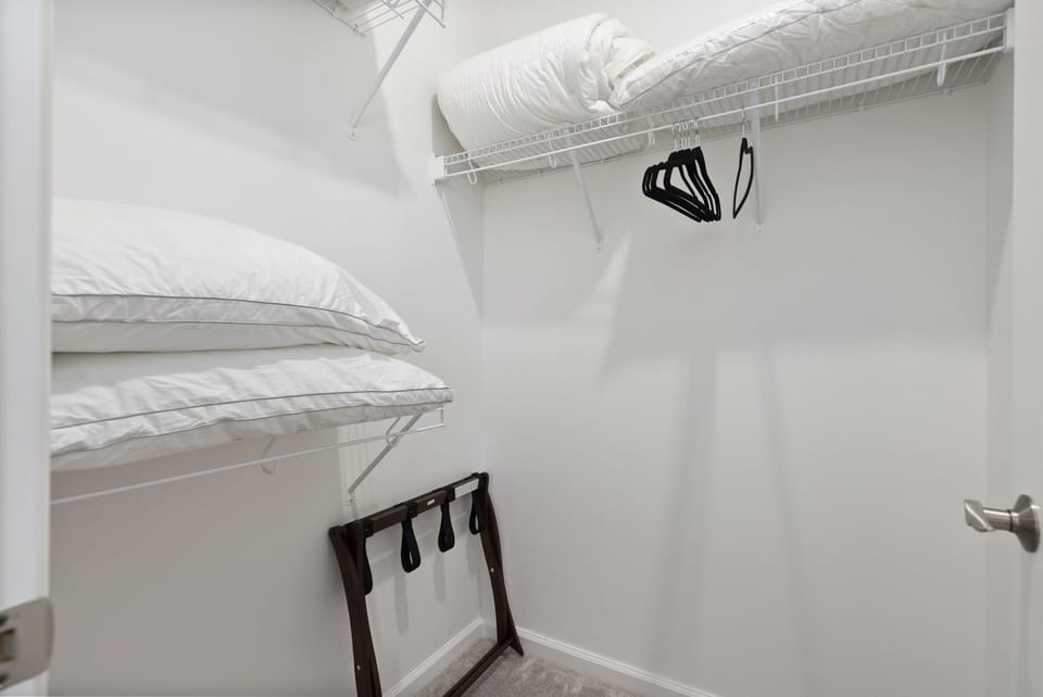 Primary bedroom's walk-in closet.