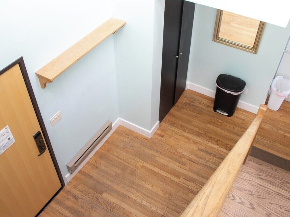 Step into the inviting foyer where the blend of wooden floors and modern accents creates a perfect first impression. You'll find the space both practical and stylish, setting the tone for a memorable stay..