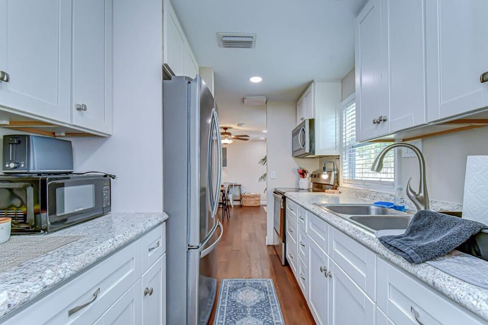 Everything you need for home-cooked meals, including stainless appliances and everything you need to make a small or large meal