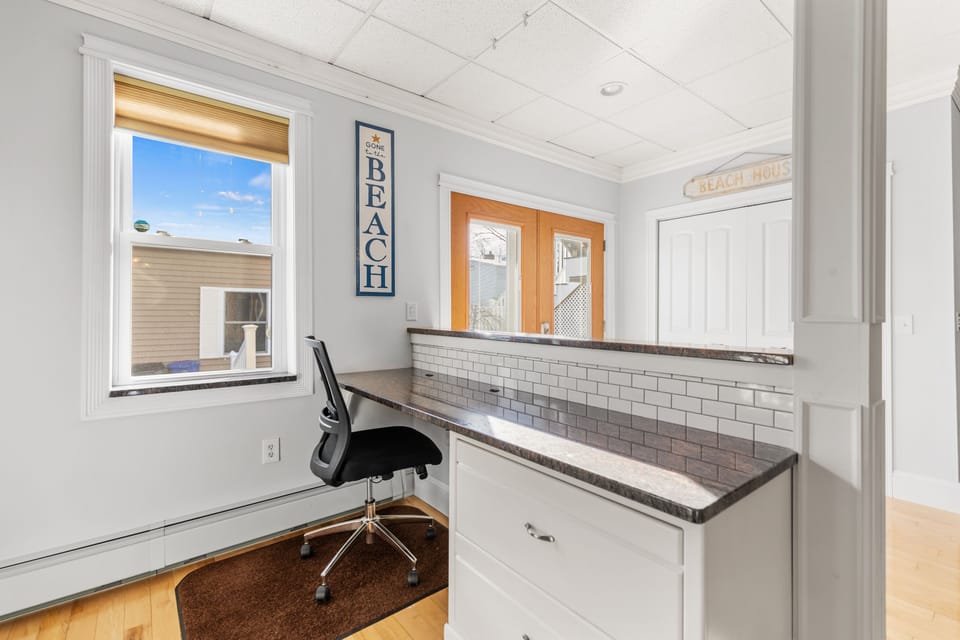 Your very own workspace with granite countertop and built in file cabinet.