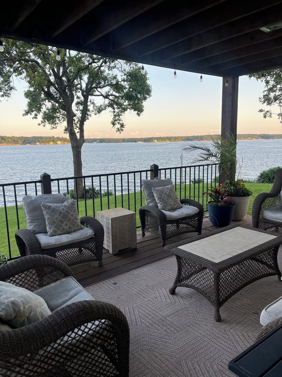 Main level deck with covered patio living room, dining, and hot tub