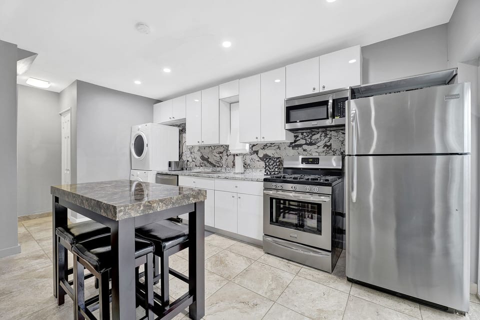 kitchen with dining room and island bar table with stools
