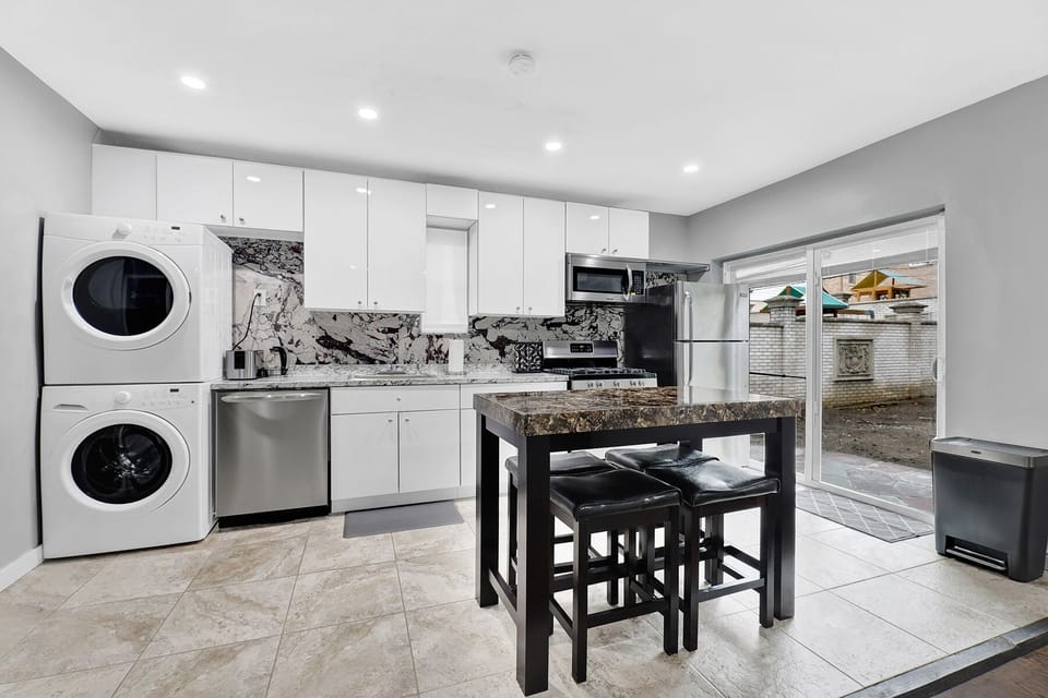 kitchen with dining room and island bar table with stools