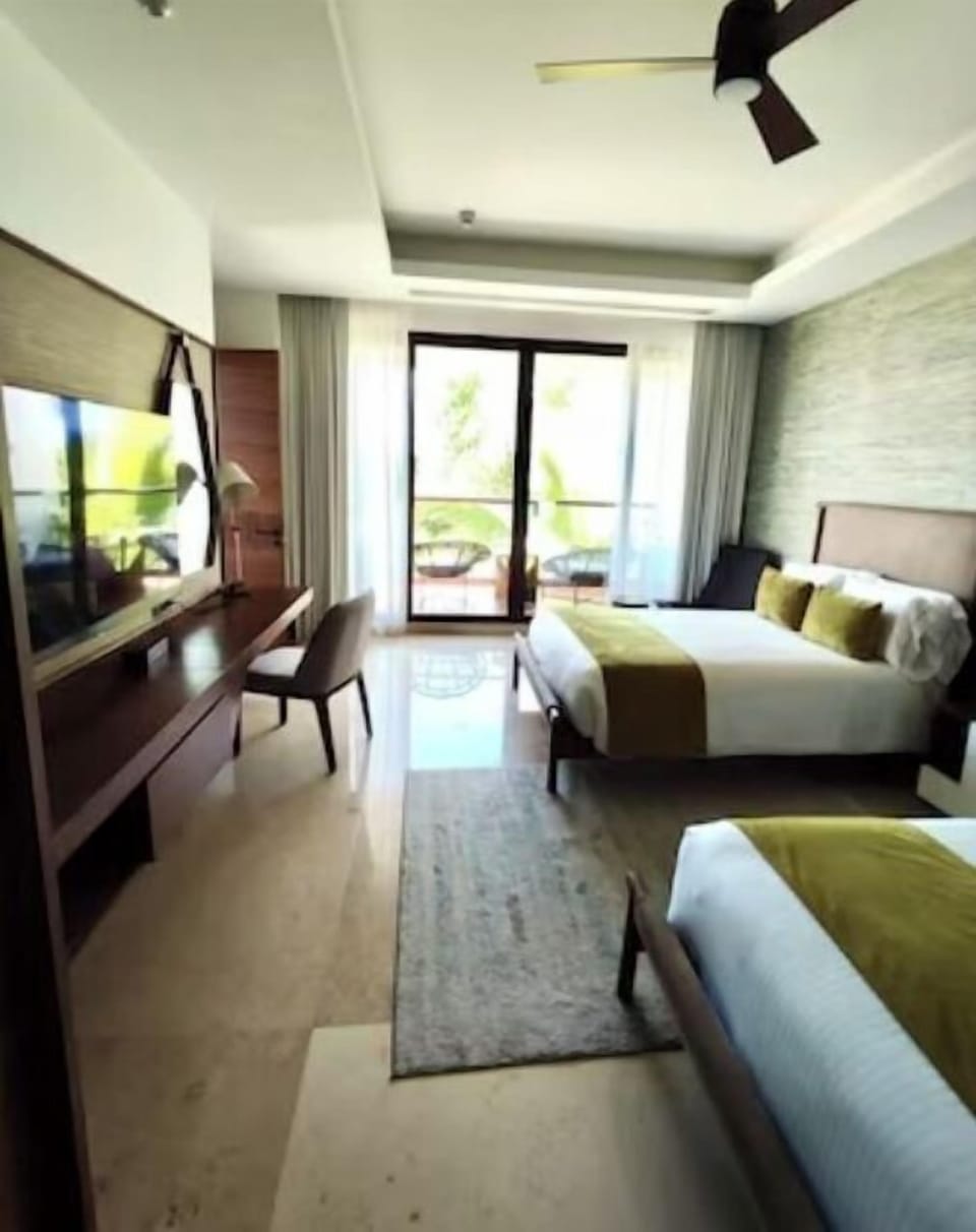 One of Two large bedrooms with two Queen Beds and Ensuite Bathrooms