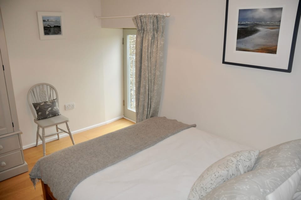 The third double bedroom with luxury ViSpring mattress enjoys courtyard views.
