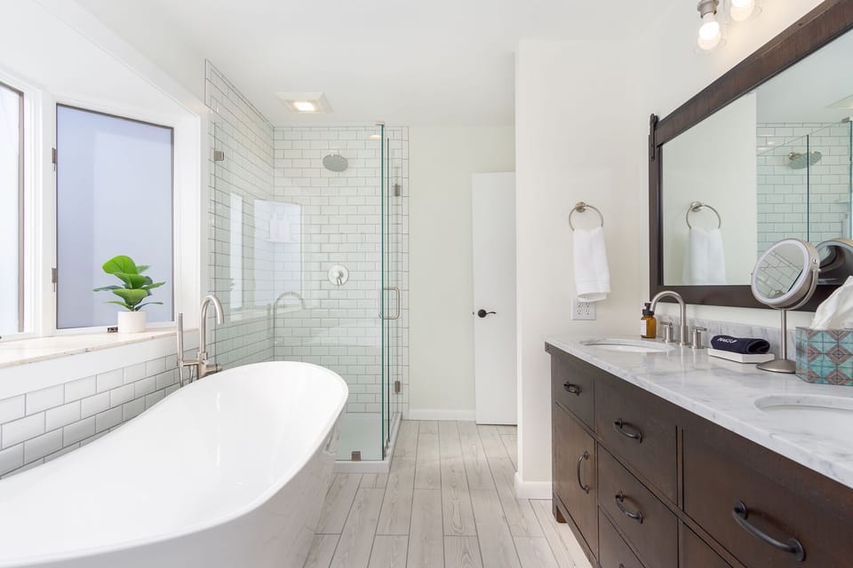 New, bright and clean bathroom w/ separate shower, large bathtub, double vanity.