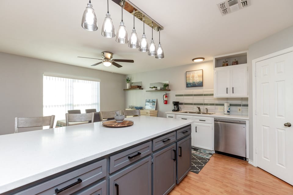 Kitchen and dining area with large counters to cook meals and entertain with the family