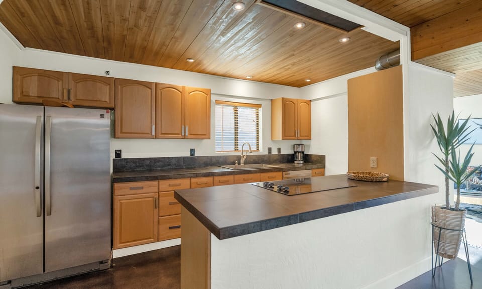 Kitchen fully stocked with equipment, cooking & eating supplies.